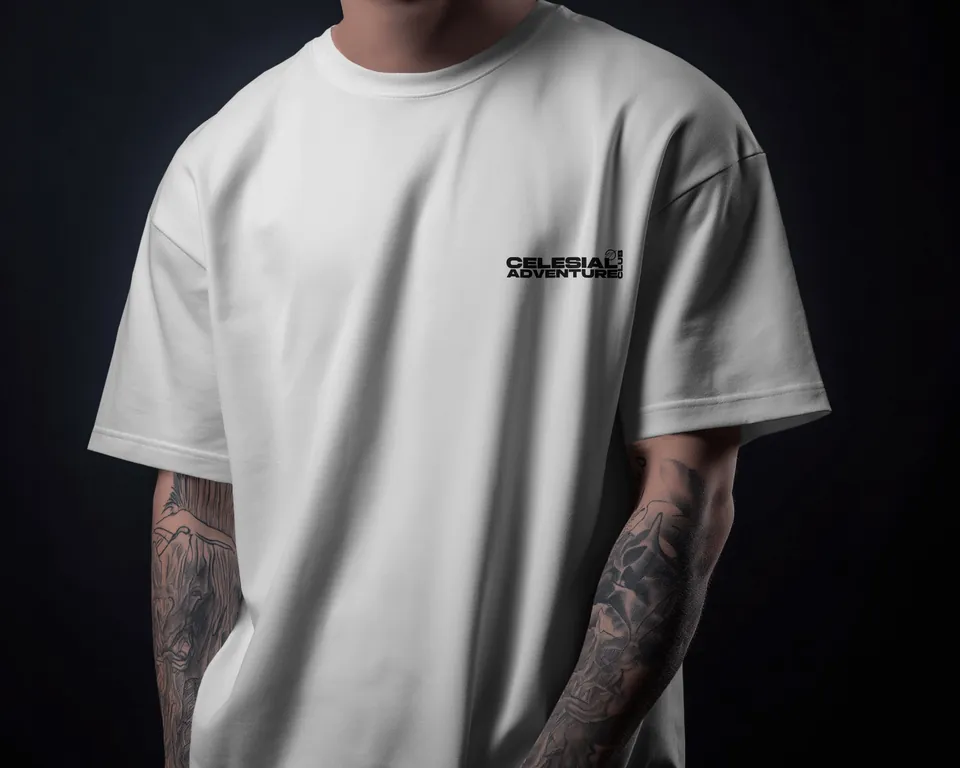 Tattooed model wearing the Saint White Consciousness oversized t-shirt